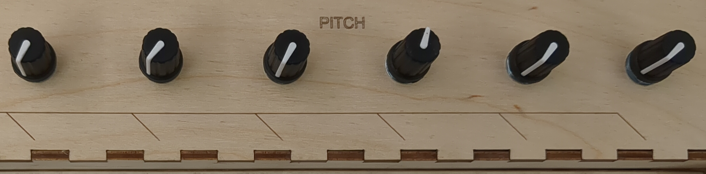 Close up of the SQID-6 per-key pitch control knobs.